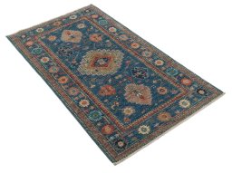 Corner detail of New Kazak rug showing border pattern and Wool pile