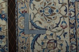 Backside of handmade 2000s Nain rug showing knot structure and weave density