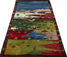 Surface texture of 2000s Persian Gabbeh rug with natural Wool and intricate pattern