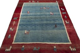 Surface texture of 2000s Persian Gabbeh rug with natural Wool and intricate pattern