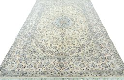Surface texture of 2000s Nain rug with natural Wool and intricate pattern