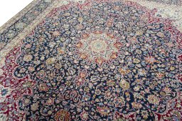 Backside of handmade 1970s Kerman rug showing knot structure and weave density