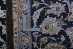 Backside of handmade 2000s Najafabad rug showing knot structure and weave density
