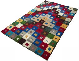 Corner detail of 2000s Persian Gabbeh rug showing border pattern and Wool pile