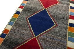 Backside of handmade 1970s Persian Gabbeh rug showing knot structure and weave density
