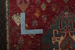 Backside of handmade 2000s Shiraz rug showing knot structure and weave density