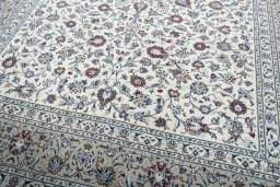 Close-up detail of 2000s Kashan rug from Iran / Persia showing Wool weave