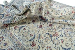 Surface texture of 2000s Nain rug with natural Wool and intricate pattern