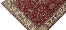 Backside of handmade New Farahan rug showing knot structure and weave density