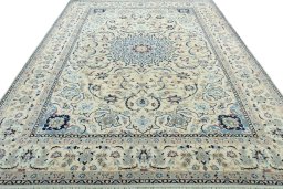Surface texture of 2000s Nain rug with natural Wool and intricate pattern