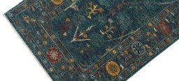 Backside of handmade New Farahan rug showing knot structure and weave density
