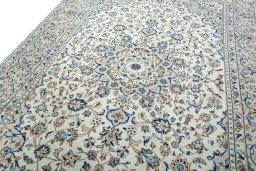 Backside of handmade 2000s Kashan rug showing knot structure and weave density