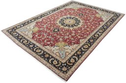 Corner detail of 2000s Tabriz 50/60/70 Raj rug showing border pattern and Cork pile