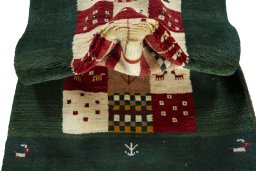 Corner detail of 2000s Persian Gabbeh rug showing border pattern and Wool pile