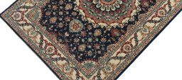 Backside of handmade New Farahan rug showing knot structure and weave density