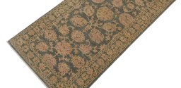 Backside of handmade New Farahan rug showing knot structure and weave density