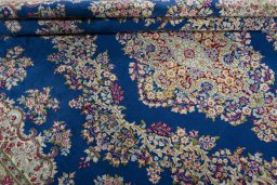 Close-up detail of 1970s Kerman rug from Iran / Persia showing Wool weave