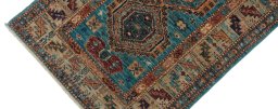 Backside of handmade New Kazak rug showing knot structure and weave density