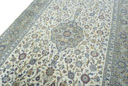 Backside of handmade New Kashan rug showing knot structure and weave density