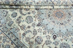 Close-up detail of New Nain rug from Iran / Persia showing Wool weave