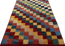 Surface texture of 2000s Persian Gabbeh rug with natural Wool and intricate pattern
