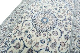 Backside of handmade New Nain rug showing knot structure and weave density