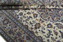 Close-up detail of 2000s Kashan rug from Iran / Persia showing Wool weave