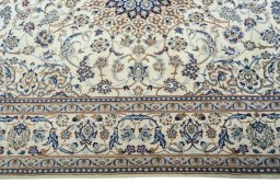 Corner detail of 2000s Nain rug showing border pattern and Wool pile
