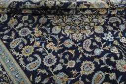 Close-up detail of 2000s Kashan rug from Iran / Persia showing Wool weave
