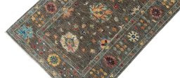 Backside of handmade New Farahan rug showing knot structure and weave density