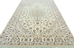 Surface texture of 2000s Nain rug with natural Wool and intricate pattern