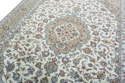 Backside of handmade 2000s Kashan rug showing knot structure and weave density