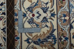 Backside of handmade 2000s Nain rug showing knot structure and weave density