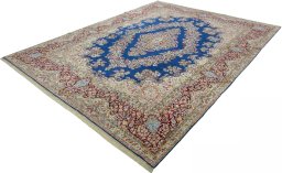 Corner detail of 1970s Kerman rug showing border pattern and Wool pile