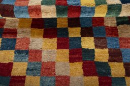 Full view of 2000s Persian Gabbeh rug from Pakistan, 200 × 140 cm in Multi Color tones