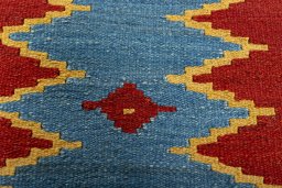 Backside of handmade New Modern Design rug showing knot structure and weave density