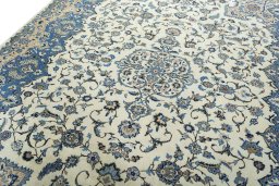 Backside of handmade 2000s Kashan rug showing knot structure and weave density