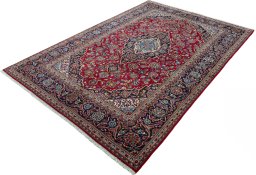 Corner detail of 2000s Kashan rug showing border pattern and Wool pile