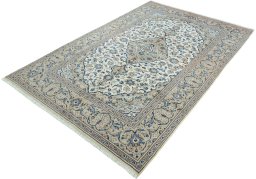 Corner detail of 2000s Kashan rug showing border pattern and Wool pile