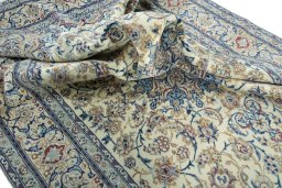 Surface texture of 2000s Nain rug with natural Wool and intricate pattern