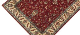 Backside of handmade New Farahan rug showing knot structure and weave density