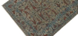 Backside of handmade New Farahan rug showing knot structure and weave density