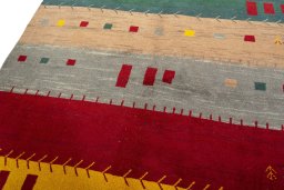 Backside of handmade 2000s Persian Gabbeh rug showing knot structure and weave density