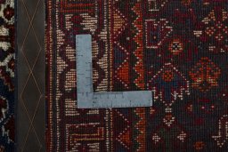 Surface texture of 2000s Shiraz rug with natural Wool and intricate pattern