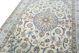 Backside of handmade 2000s Nain rug showing knot structure and weave density
