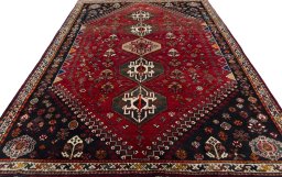 Surface texture of 2000s Shiraz rug with natural Wool and intricate pattern