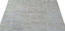 Backside of handmade New Morocco rug showing knot structure and weave density