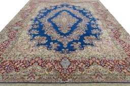 Surface texture of 1970s Kerman rug with natural Wool and intricate pattern