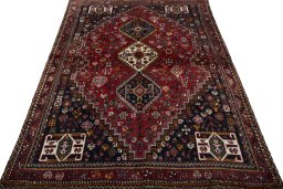 Surface texture of 2000s Shiraz rug with natural Wool and intricate pattern