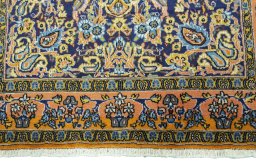 Close-up detail of 1970s Ghom rug from Iran / Persia showing Wool weave